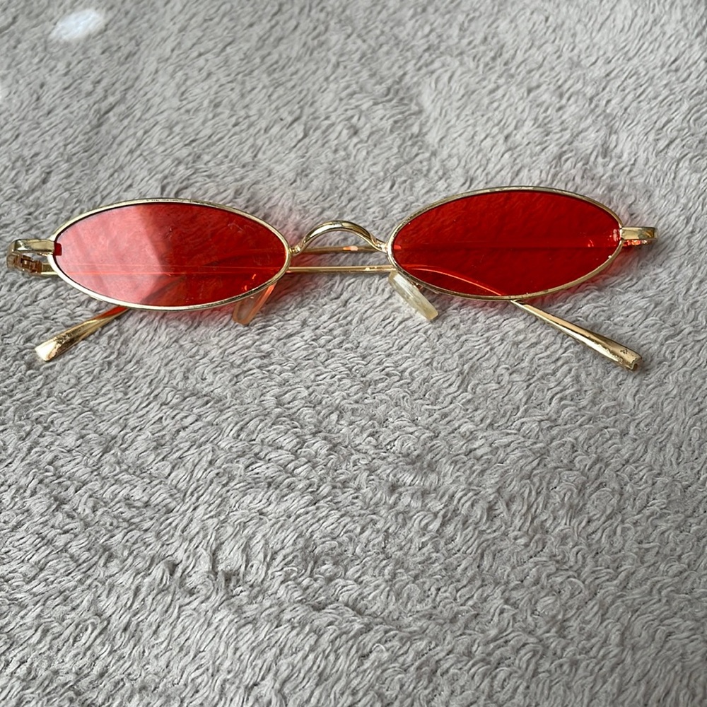 red oval sunglasses
